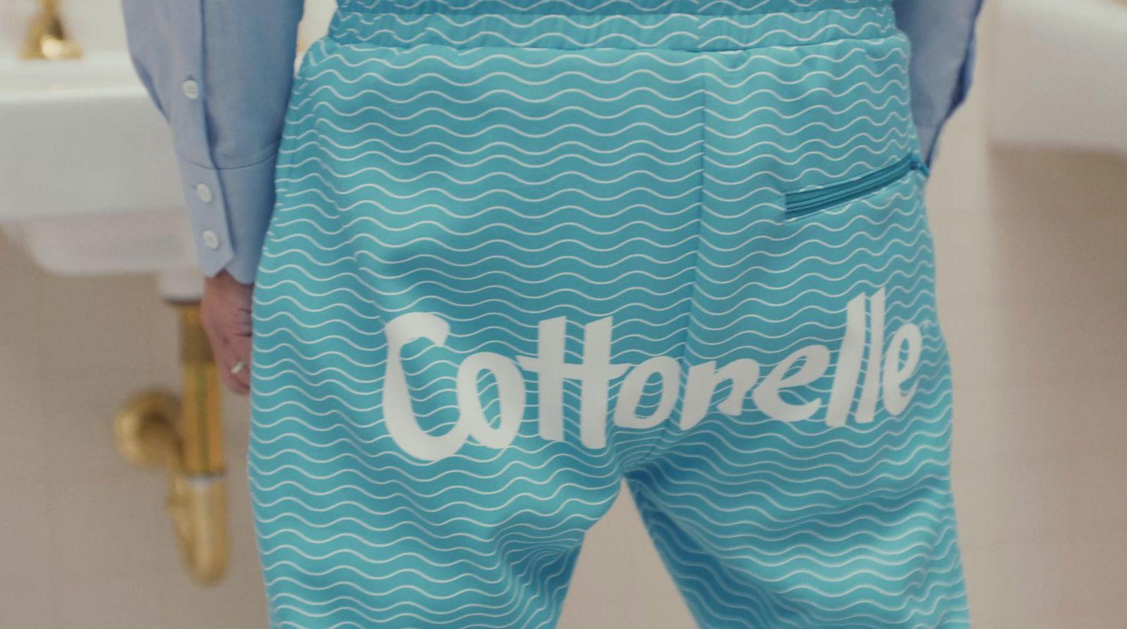 a close up of a person wearing a pair of blue shorts
