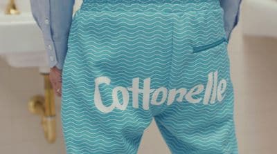 a close up of a person wearing a pair of blue shorts