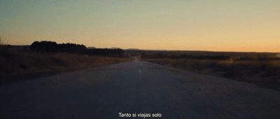 a blurry picture of a person walking down a road