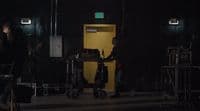 a man standing in front of a yellow door