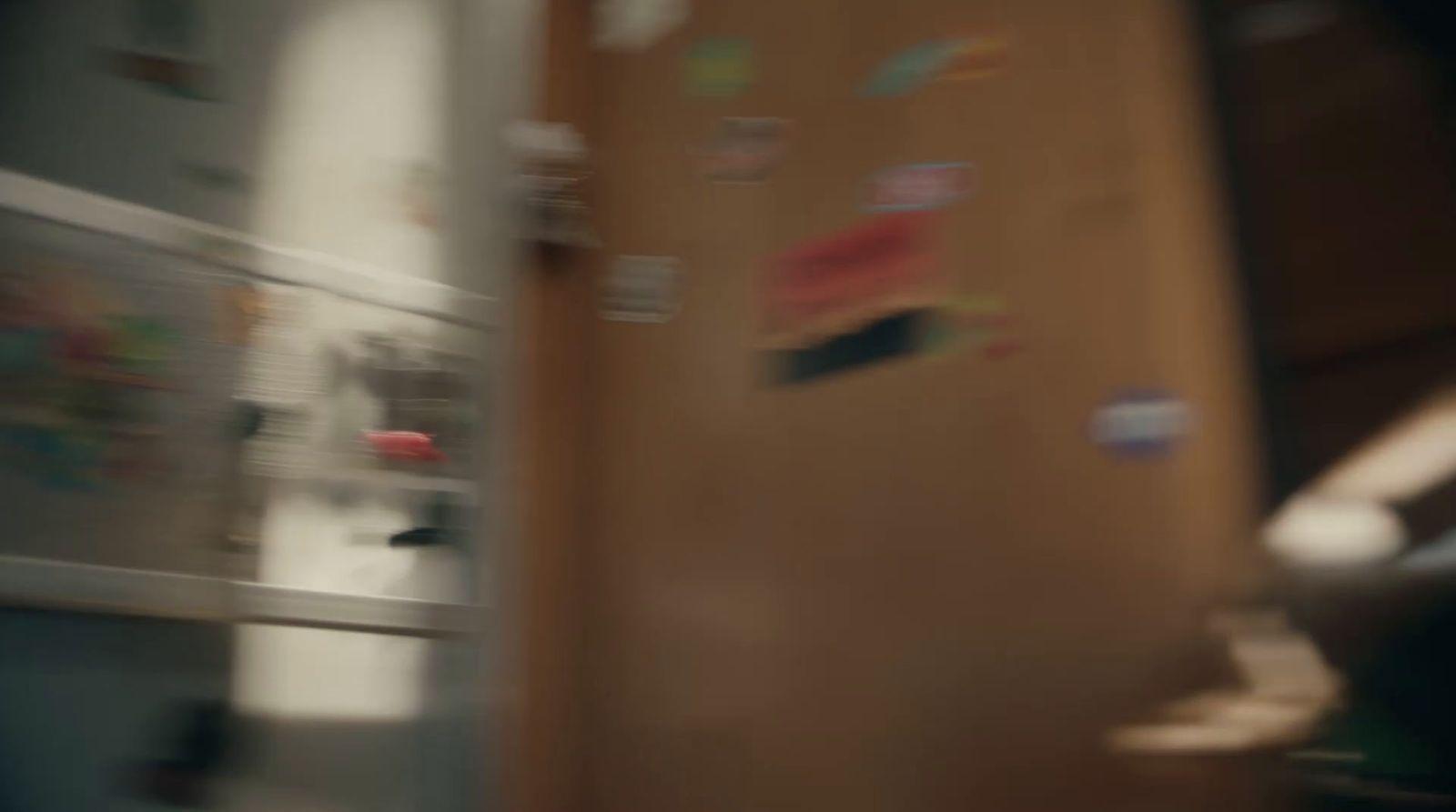 a blurry photo of a refrigerator with magnets on it