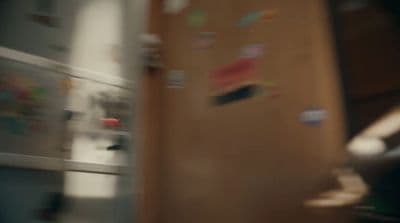a blurry photo of a refrigerator with magnets on it