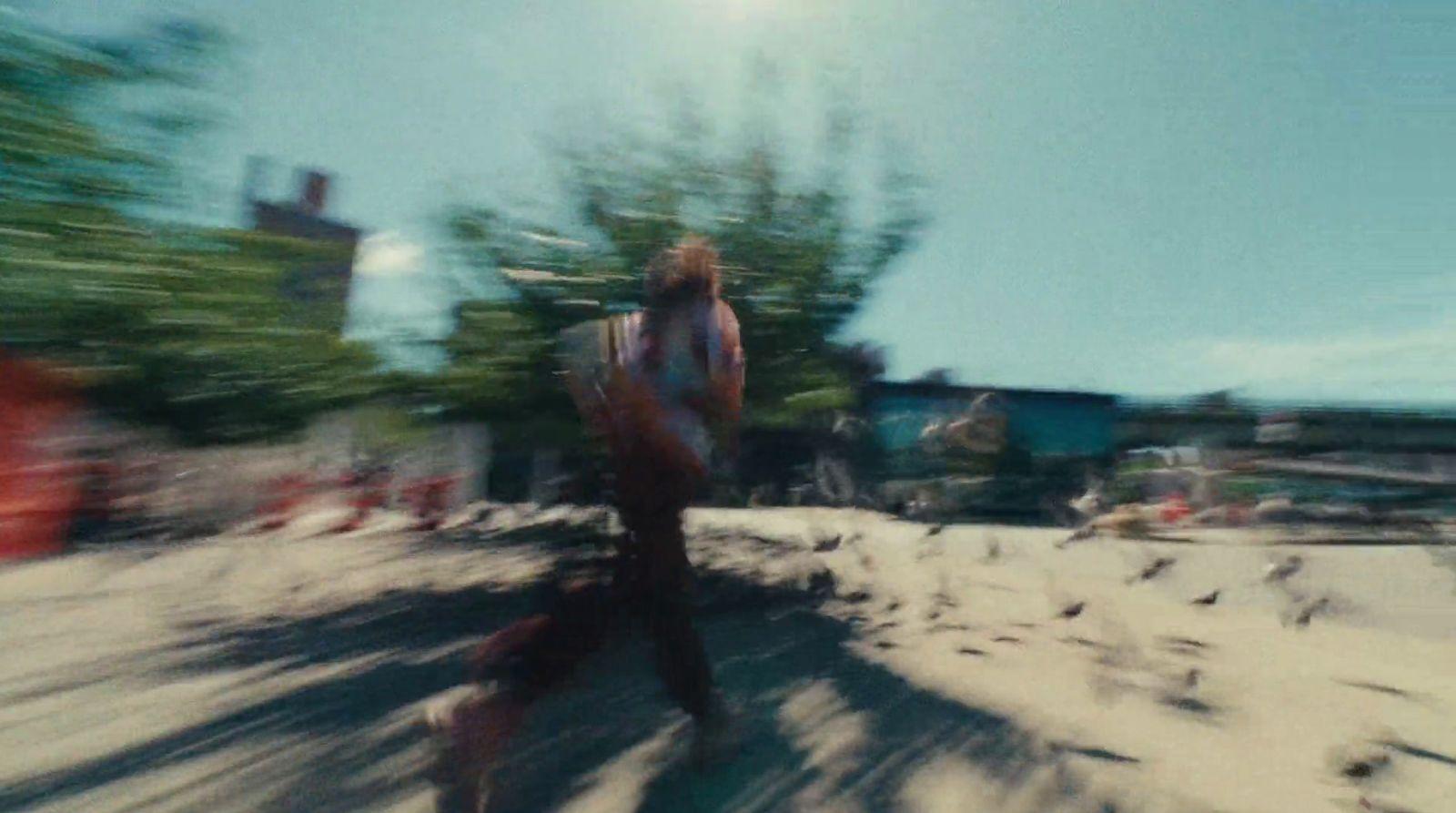 a blurry photo of a man walking down a street