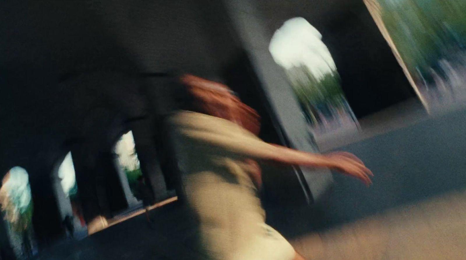 a blurry photo of a person riding a skateboard