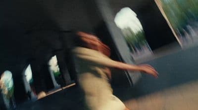 a blurry photo of a person riding a skateboard