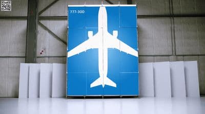 a large blue sign with a white airplane on it