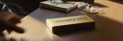 a business card sitting on top of a wooden table