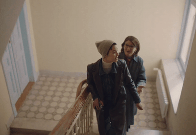 two people walking down a set of stairs
