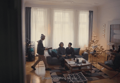 a group of people sitting around a living room