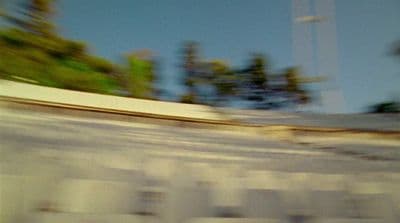a man riding a skateboard down the side of a ramp