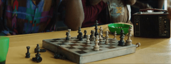 a person playing a game of chess on a table