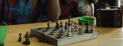 a person playing a game of chess on a table