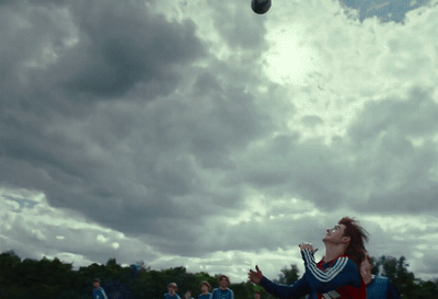 a group of young people playing a game of frisbee