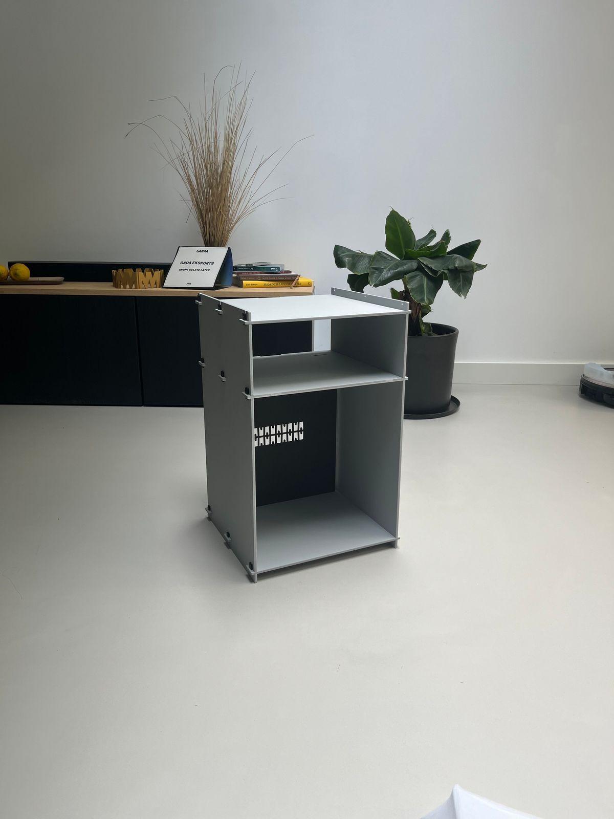 a desk with a plant on top of it