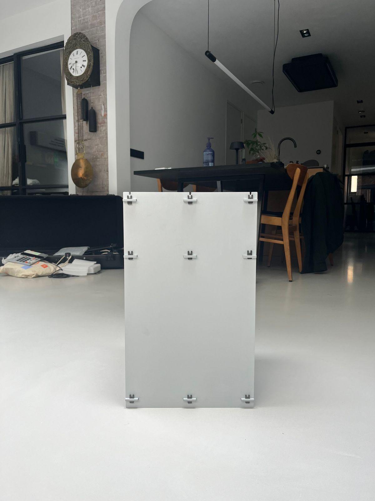 a white box sitting in the middle of a room