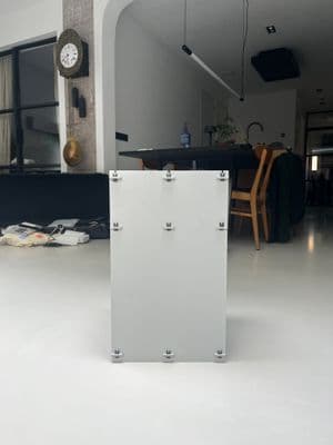 a white box sitting in the middle of a room