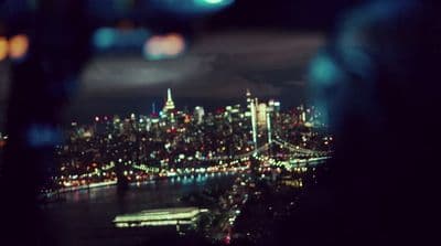 a view of a city at night from a plane