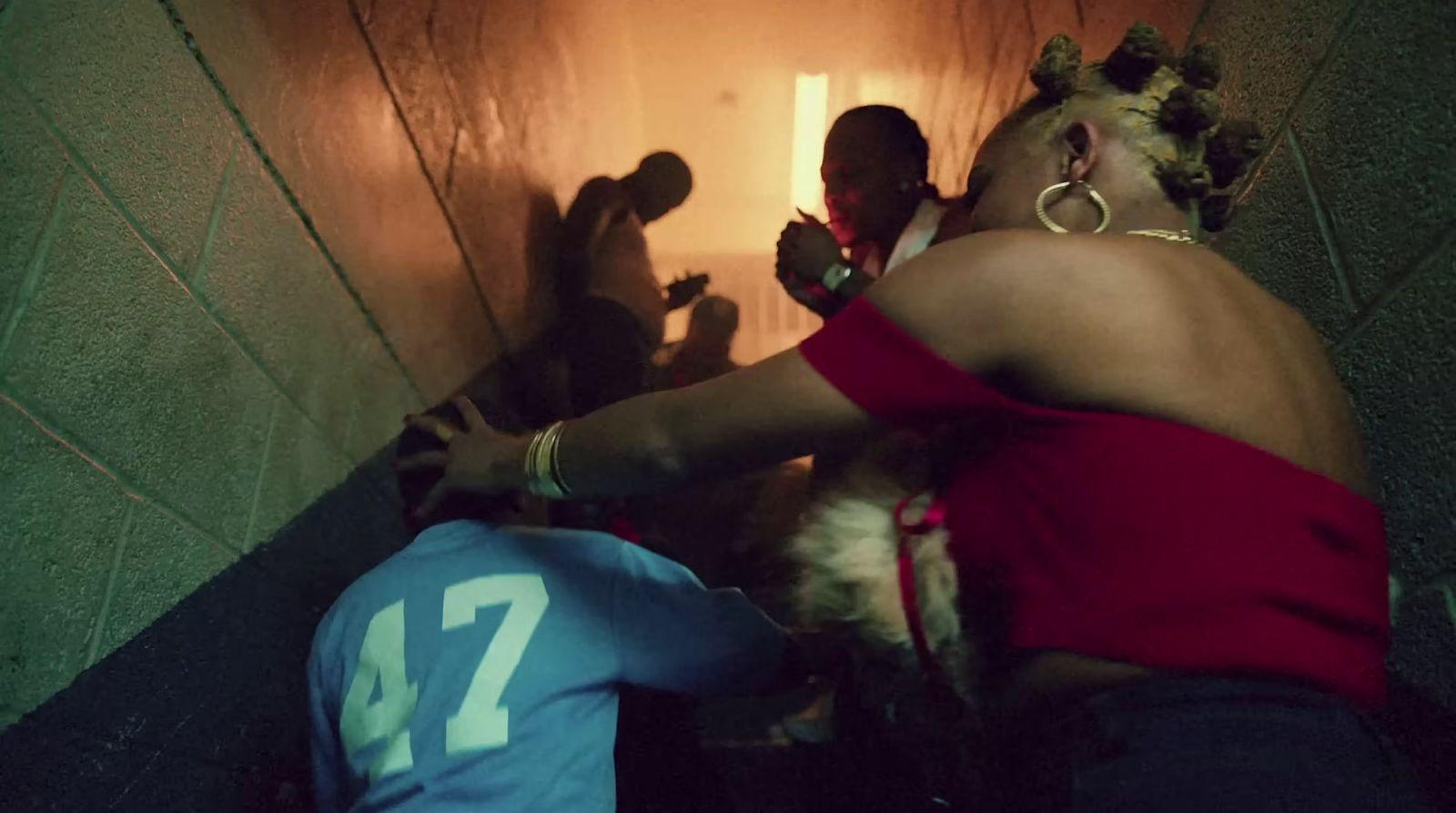 a group of people standing around in a tunnel