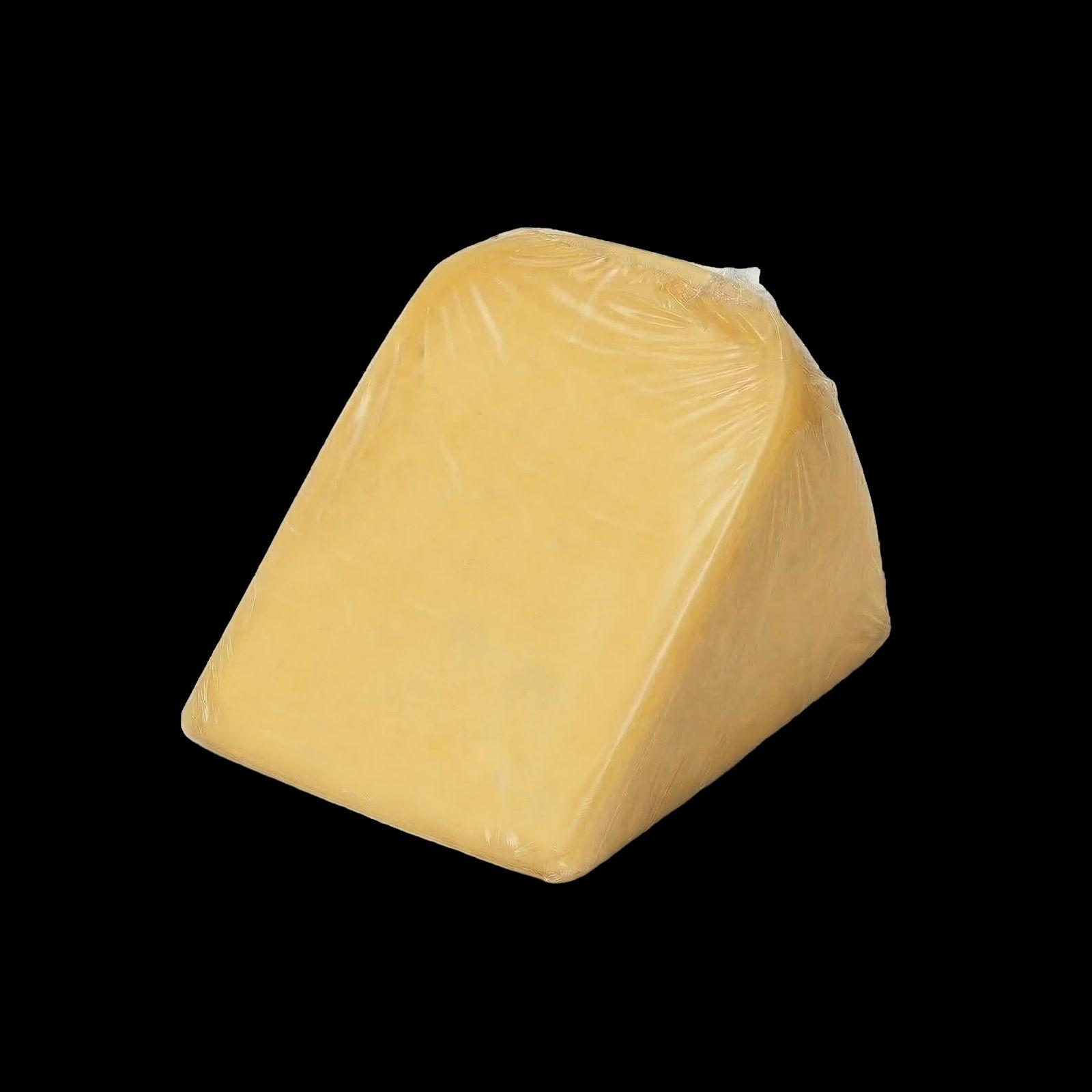 Triangular wedge of pale yellow cheese wrapped in clear plastic, isolated on a black background in a studio product photograph.