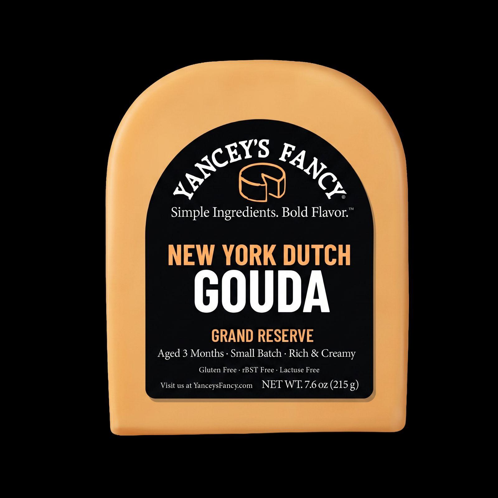 Studio product photo of an orange-gold wedge of Yancey’s Fancy New York Dutch Gouda cheese with a black label against a solid black background.