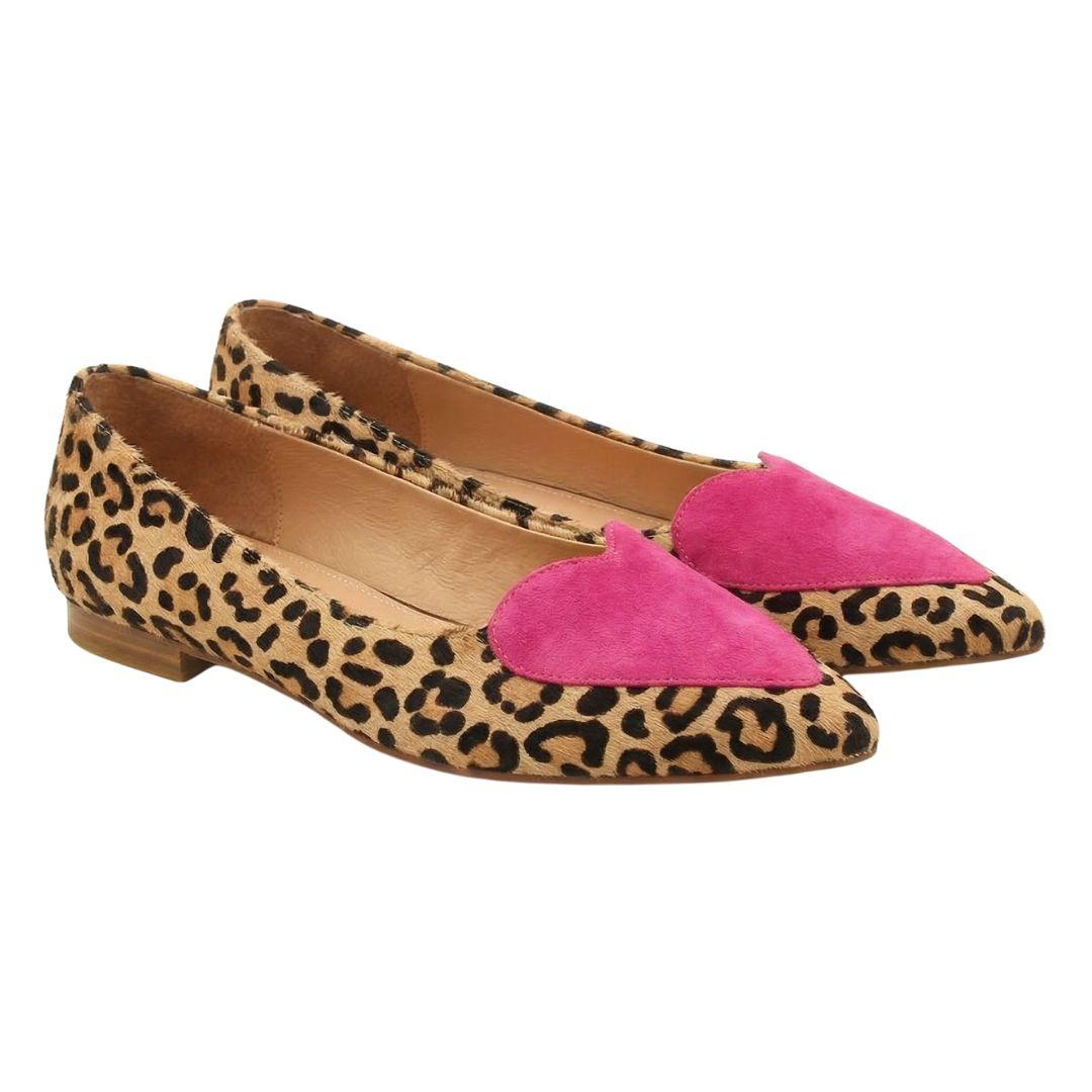 a pair of pink and leopard print shoes