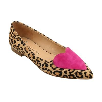 a pair of leopard print shoes with a pink heart