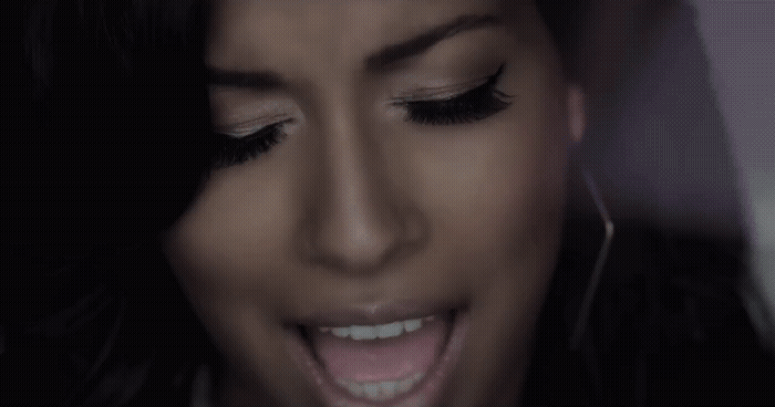 a close up of a person with her mouth open