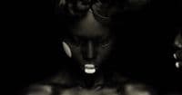 a black and white photo of a woman's face