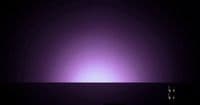 a dark room with a purple light in the middle