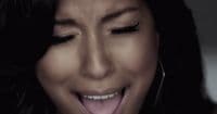 a close up of a person with her mouth open
