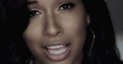 a close up of a person with a smile on her face