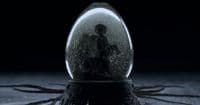 a snow globe sitting on top of a wooden table