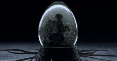 a snow globe sitting on top of a wooden table