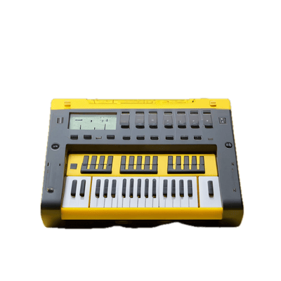 a yellow and black electronic keyboard on a black background