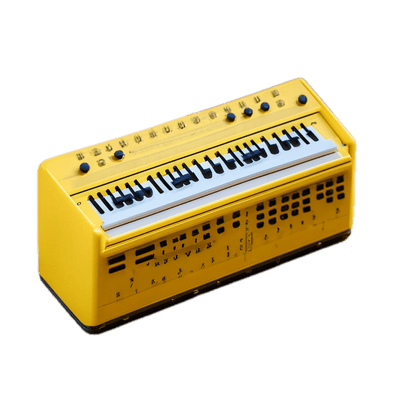 a yellow musical instrument sitting on top of a black background