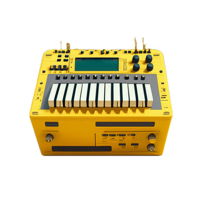 a yellow electronic device with a keyboard on top of it