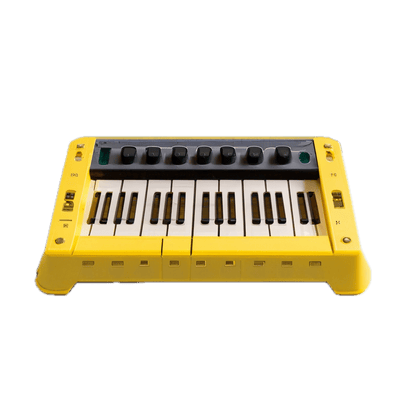a yellow and black keyboard sitting on top of a table