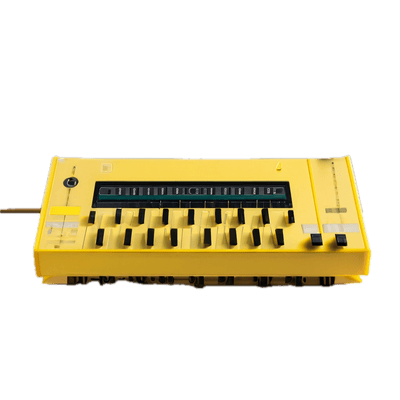 a yellow and black electronic device on a black background