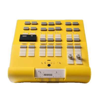 a yellow electronic device with buttons and buttons