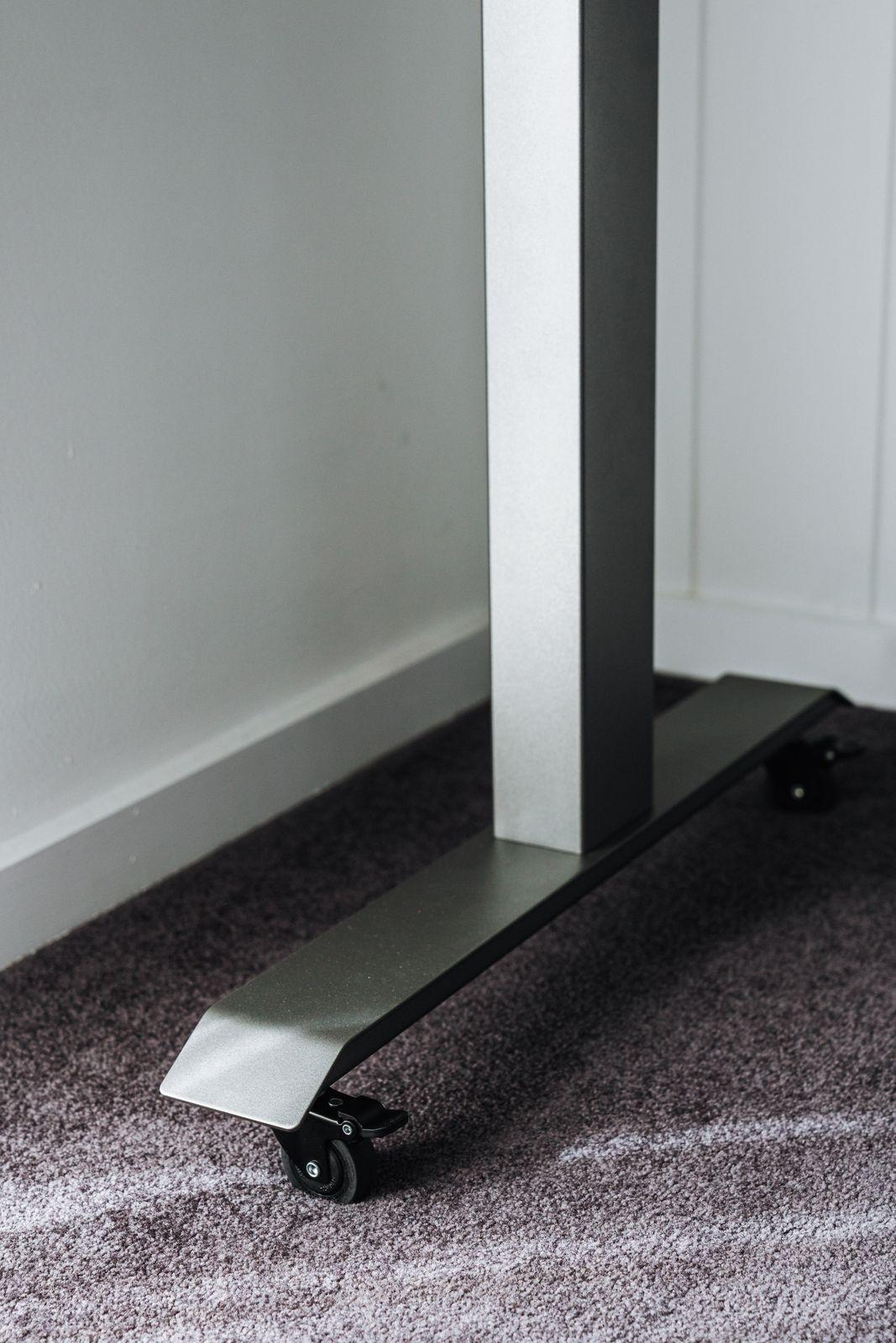 a metal object sitting on top of a carpeted floor