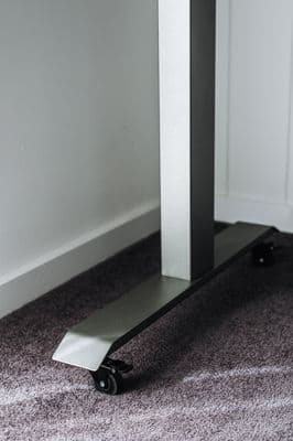 a metal object sitting on top of a carpeted floor