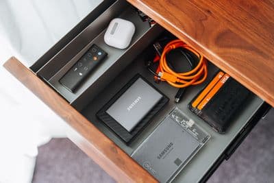 a drawer with a bunch of electronics inside of it