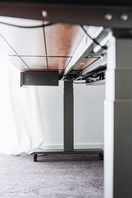 a desk with a laptop on top of it