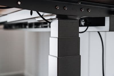 a black and white photo of a table with wires attached to it