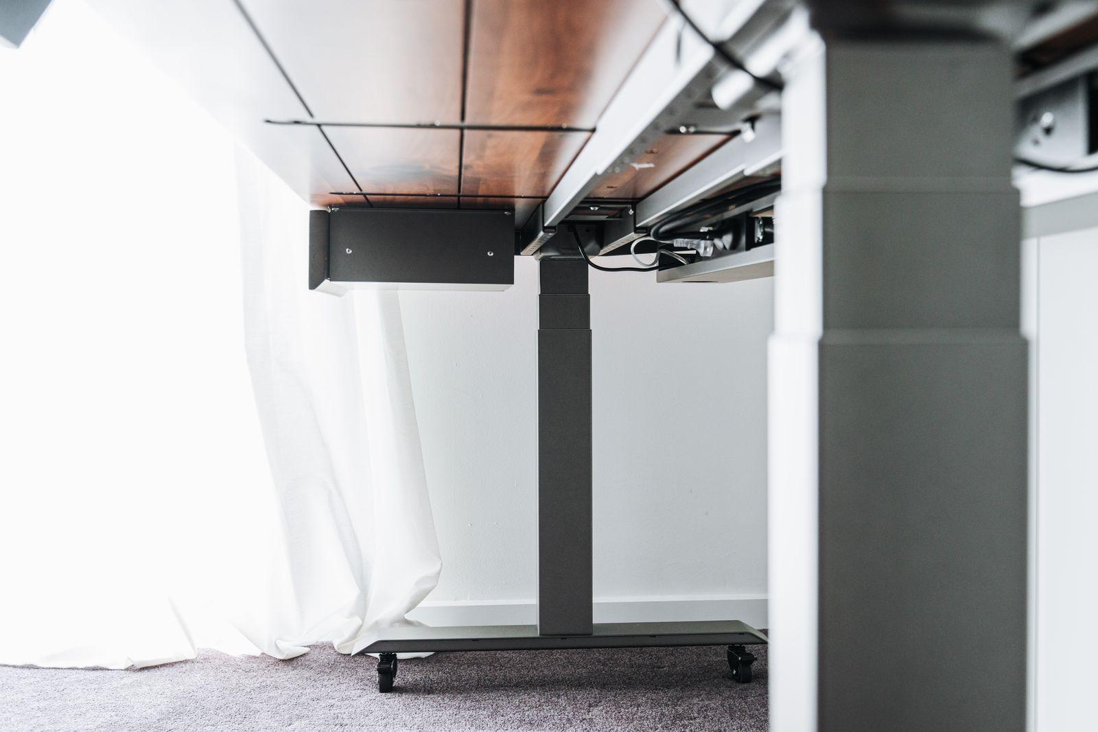 a black and white photo of a table and a white curtain