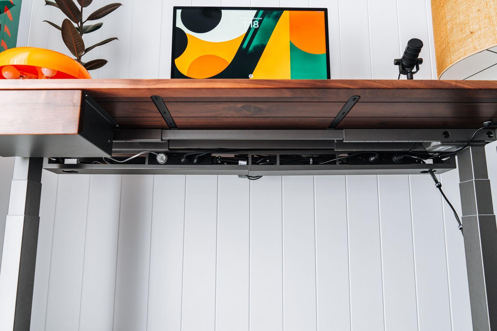 a shelf with a painting and a vase on top of it