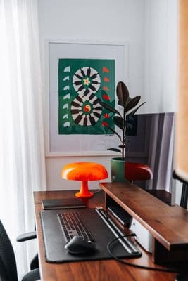 a desk with a laptop and a mouse on it