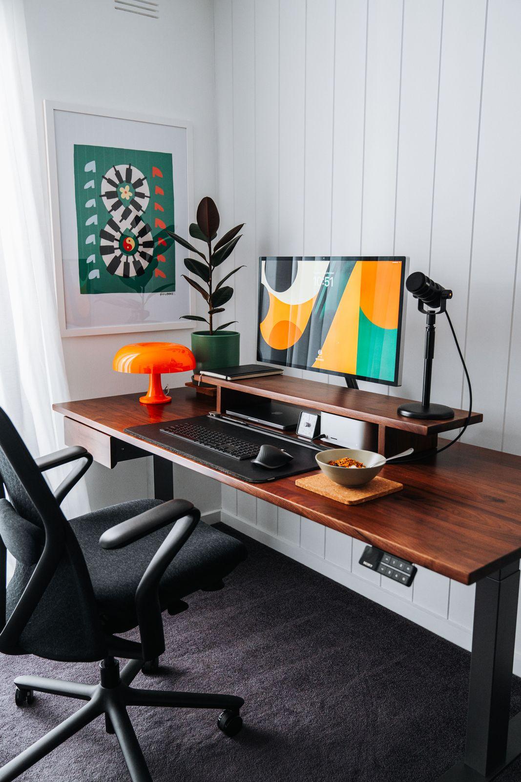 a desk with a computer on top of it