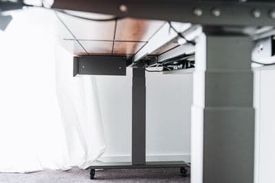 a desk with a laptop on top of it