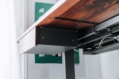 a close up of a metal and wood table
